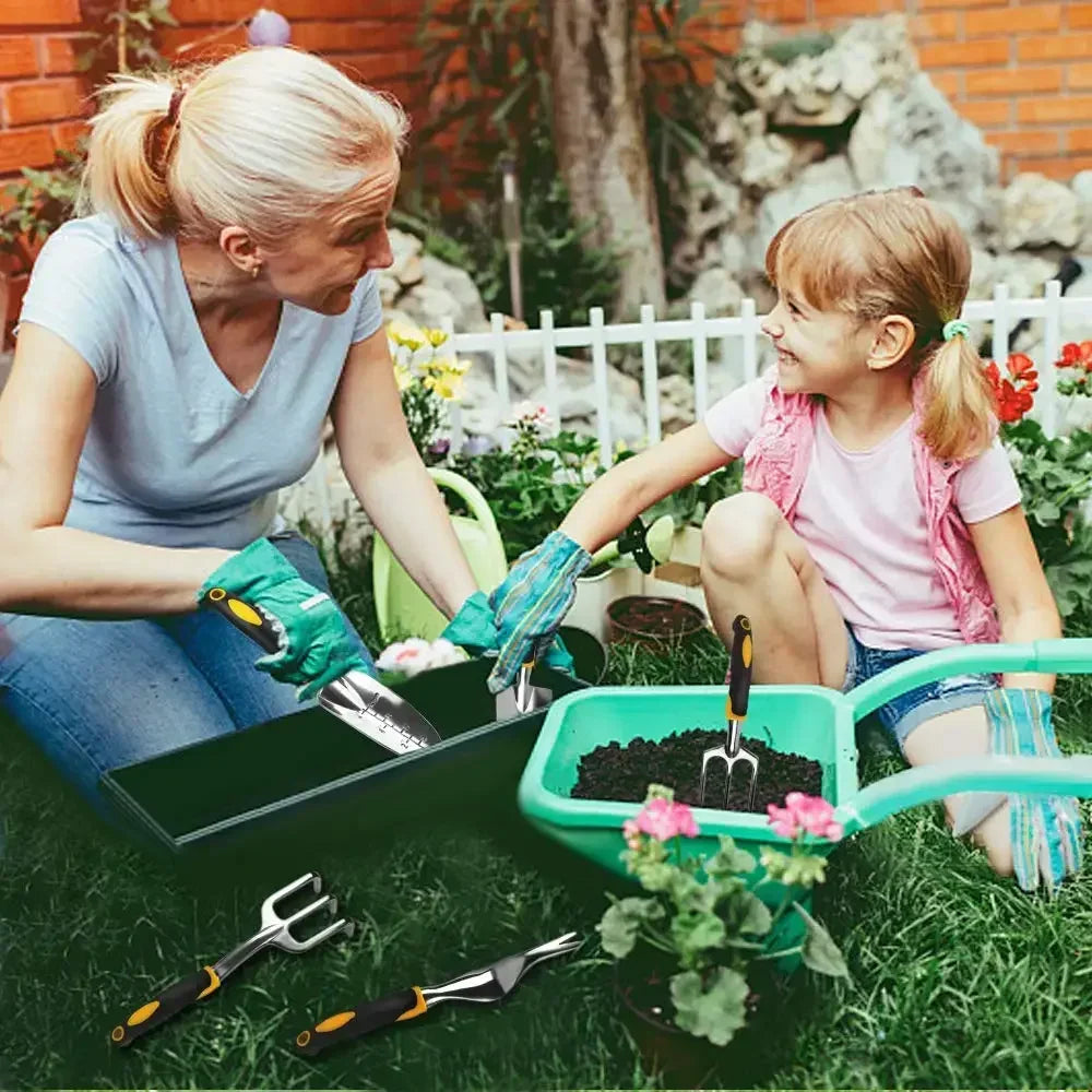 Family gardening together with garden tools